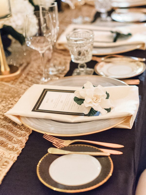 black and gold wedding table setting