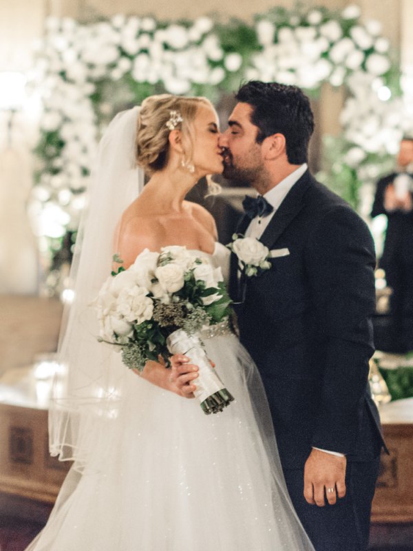 bride and groom first kiss